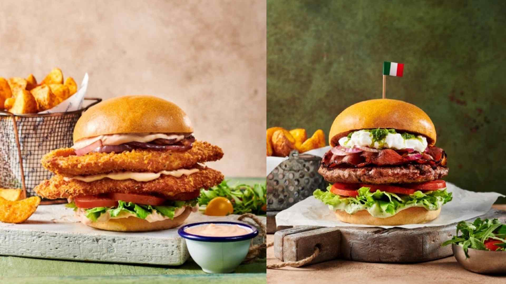 CARLUCCIO gourmet burger comparison image showing two burgers side by side, each served with fries on rustic surfaces, one featuring a crispy breaded chicken patty and the other a beef patty topped with bacon, sauce and an Italian flag toothpick.