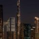 Nighttime cityscape view from LA VILLE HOTEL & SUITES showing the illuminated Burj Khalifa and Downtown Dubai skyline.