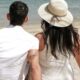 couple sitting together, sitting together in sand