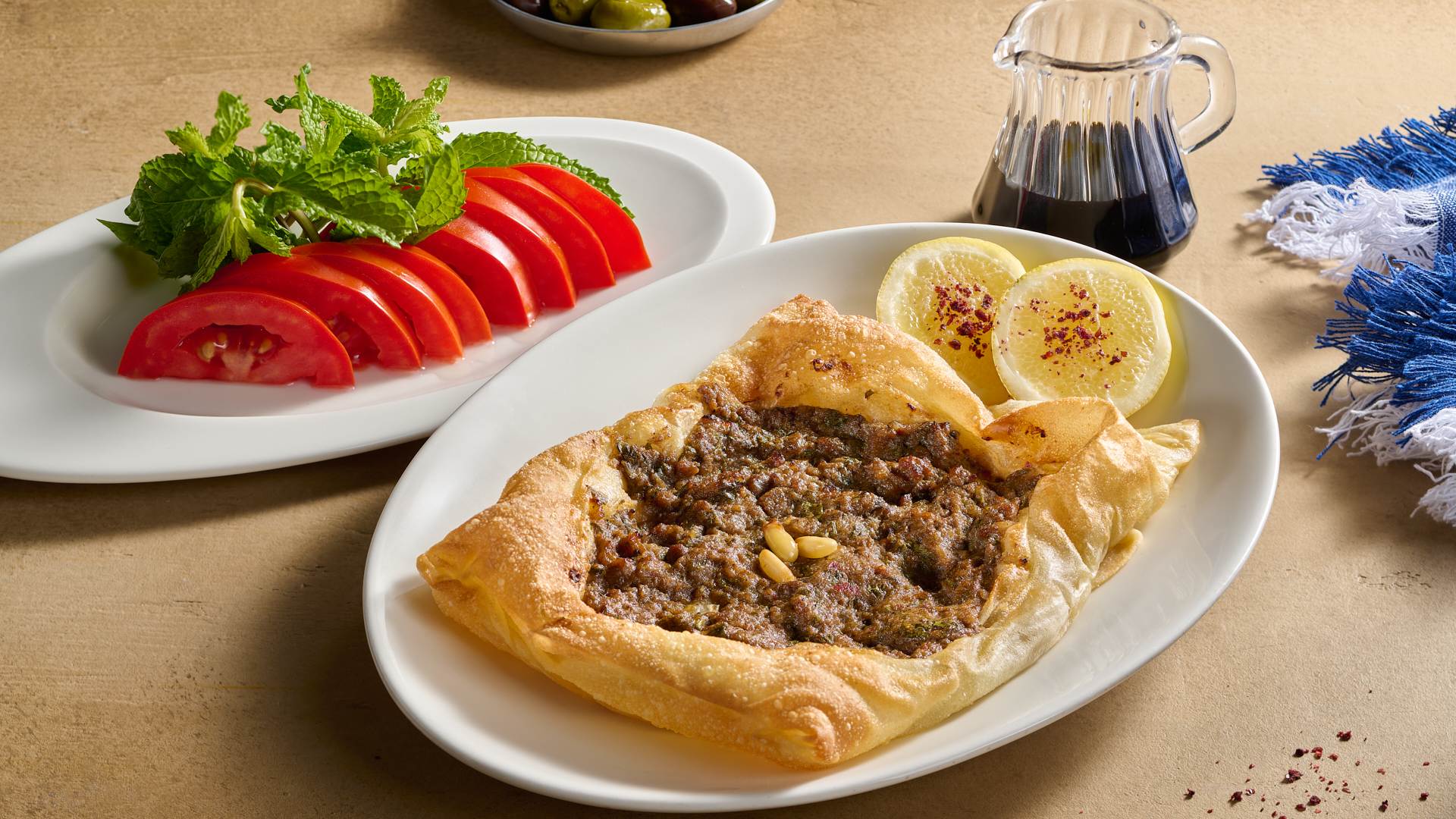 Authentic Levantine Meat Pie with Fresh Sides at Bab El Bahr