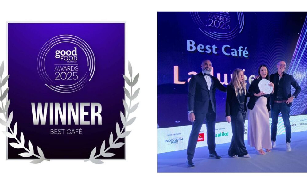 Ladurée team receiving the Best Café award on stage at the BBC Good Food Middle East Awards 2025, holding the trophy beside the official winner backdrop