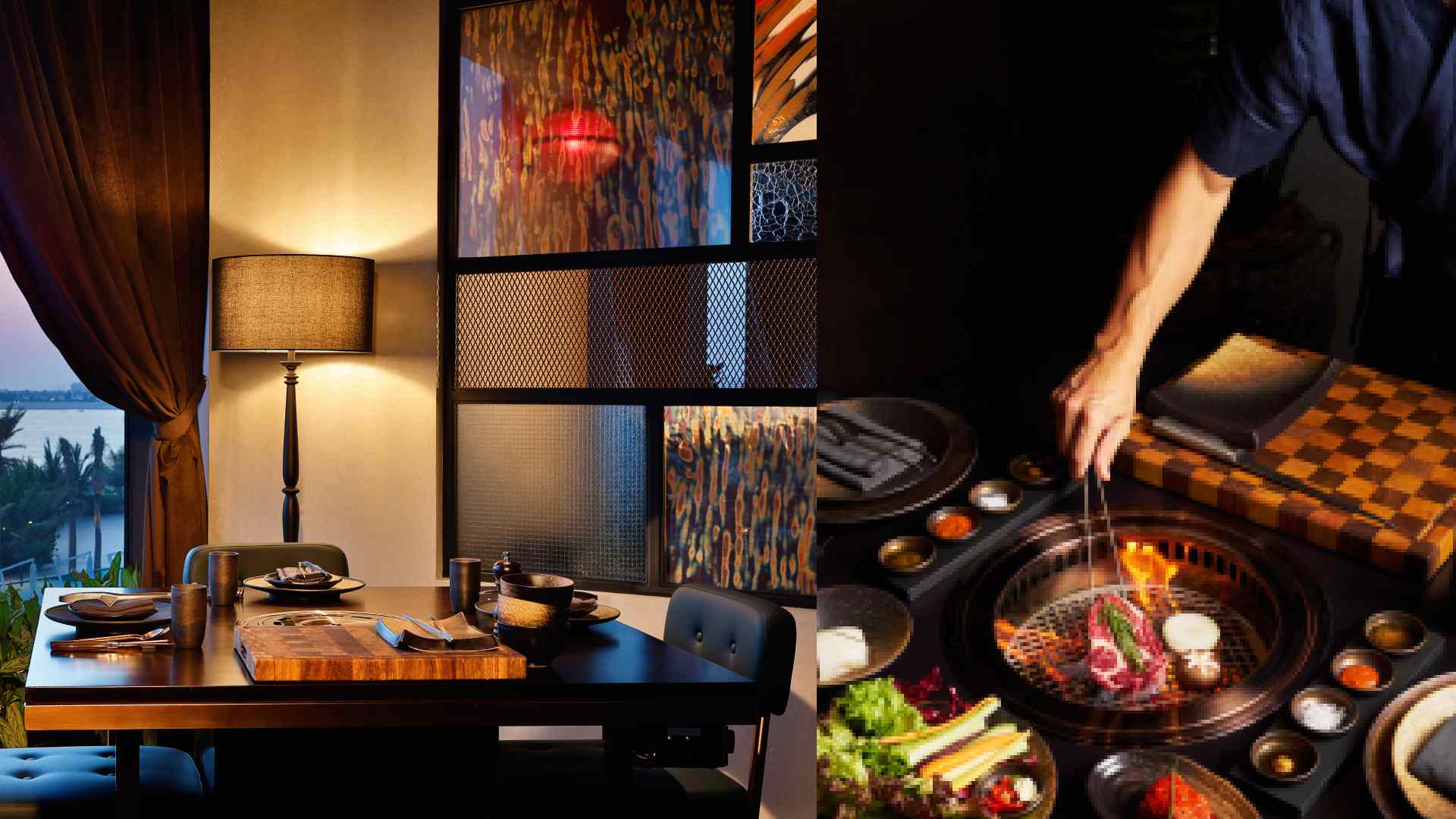 A dining setup at Smoki Moto with a wooden table set for two beside a warm lamp and patterned glass panels, alongside a chef grilling Wagyu meat over an open flame on a Korean barbecue grill surrounded by assorted side dishes and vegetables