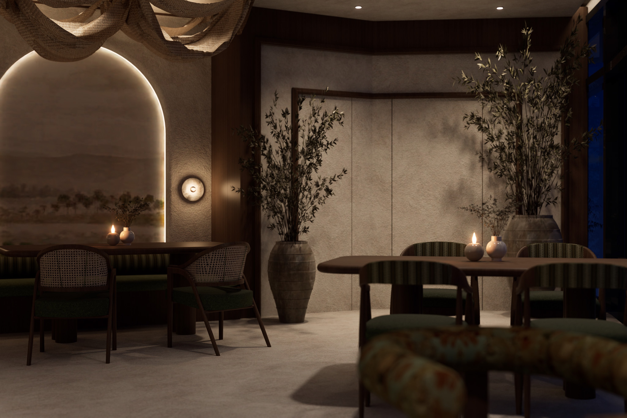 Interior seating area at Rooh by Priya featuring arched wall niche, candle-lit tables, green upholstered chairs, textured walls, and potted plants in a softly lit dining space.