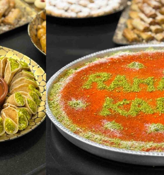 Mediterranean Ramadan dessert display at Holiday Inn Dubai Al Maktoum Airport featuring kataifi, pistachio pastries, and a large tray of knafeh decorated with “Ramadan Kareem” in pistachio powder.