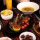 Ramadan Iftar spread with grilled lamb, dates and traditional dishes beside an elegant dining room with Marina views at DUBAI MARRIOTT HARBOUR HOTEL & SUITES