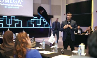 Starkey MEA speaker presenting Omega AI hearing technology to audiologists and industry professionals during a conference session in Dubai.