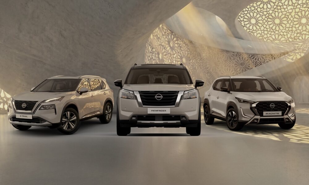 A front-facing lineup of three Nissan SUVs. The X-Trail on the left, the Pathfinder in the center, and the Magnite on the right.