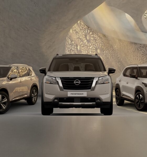A front-facing lineup of three Nissan SUVs. The X-Trail on the left, the Pathfinder in the center, and the Magnite on the right.