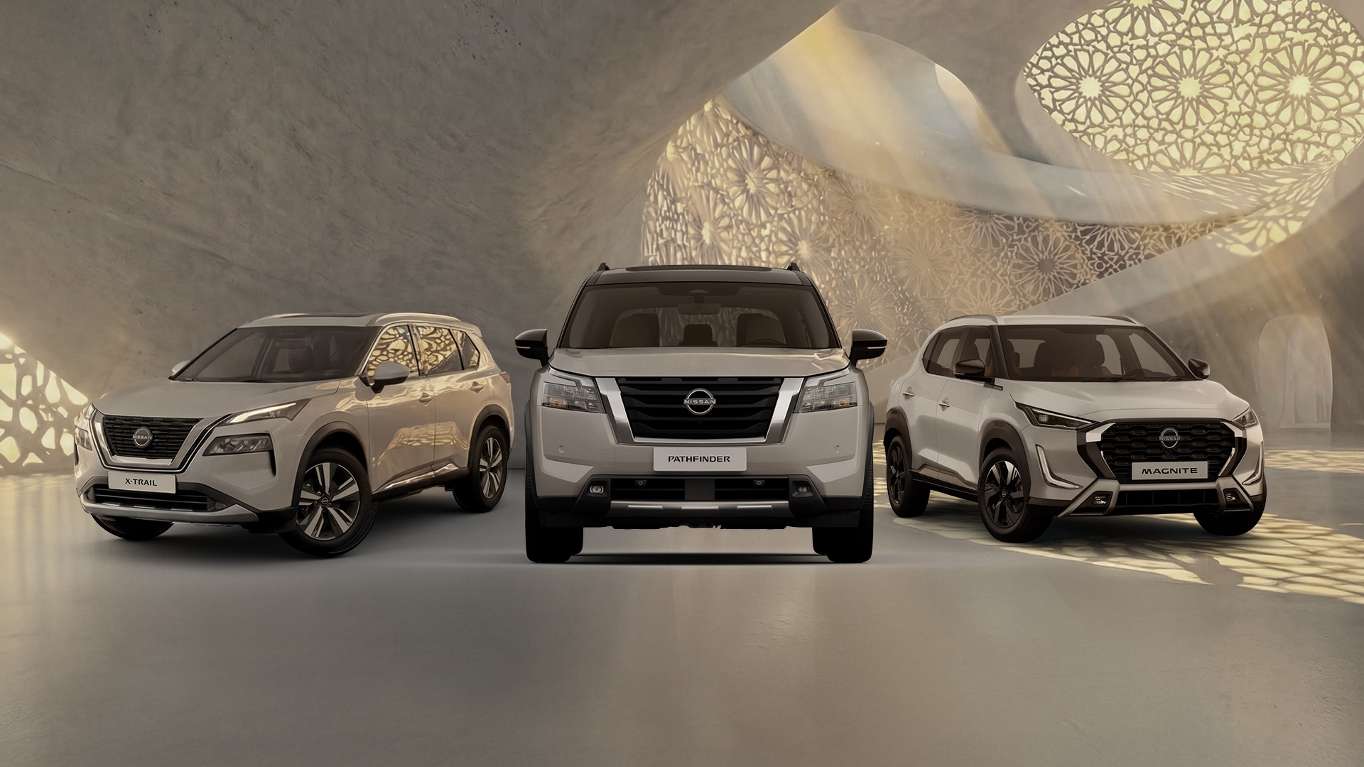 A front-facing lineup of three Nissan SUVs. The X-Trail on the left, the Pathfinder in the center, and the Magnite on the right.
